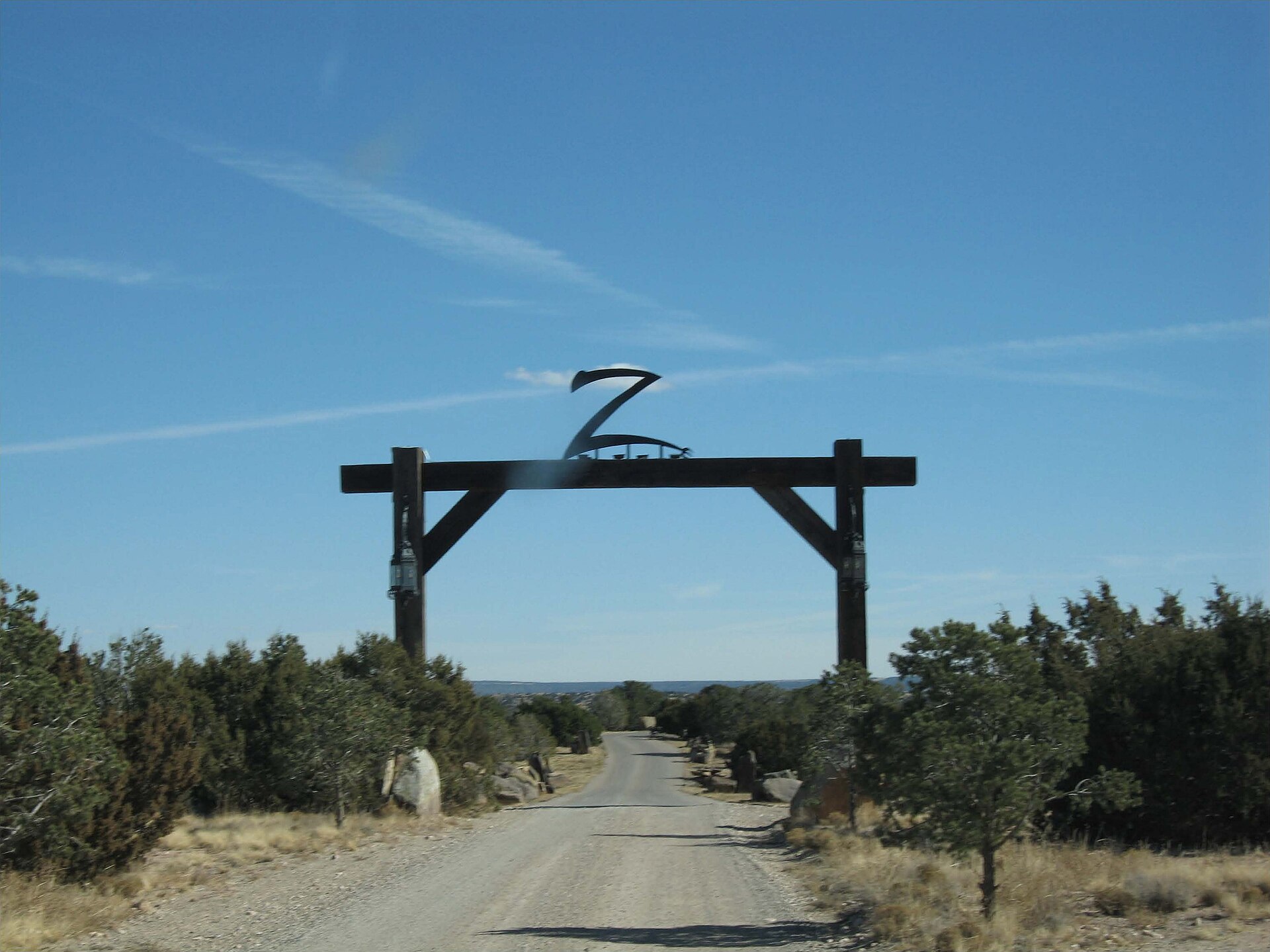 GX 328 Zorro Ranch, NM Dirt road under a wooden gate with a letter Z above it