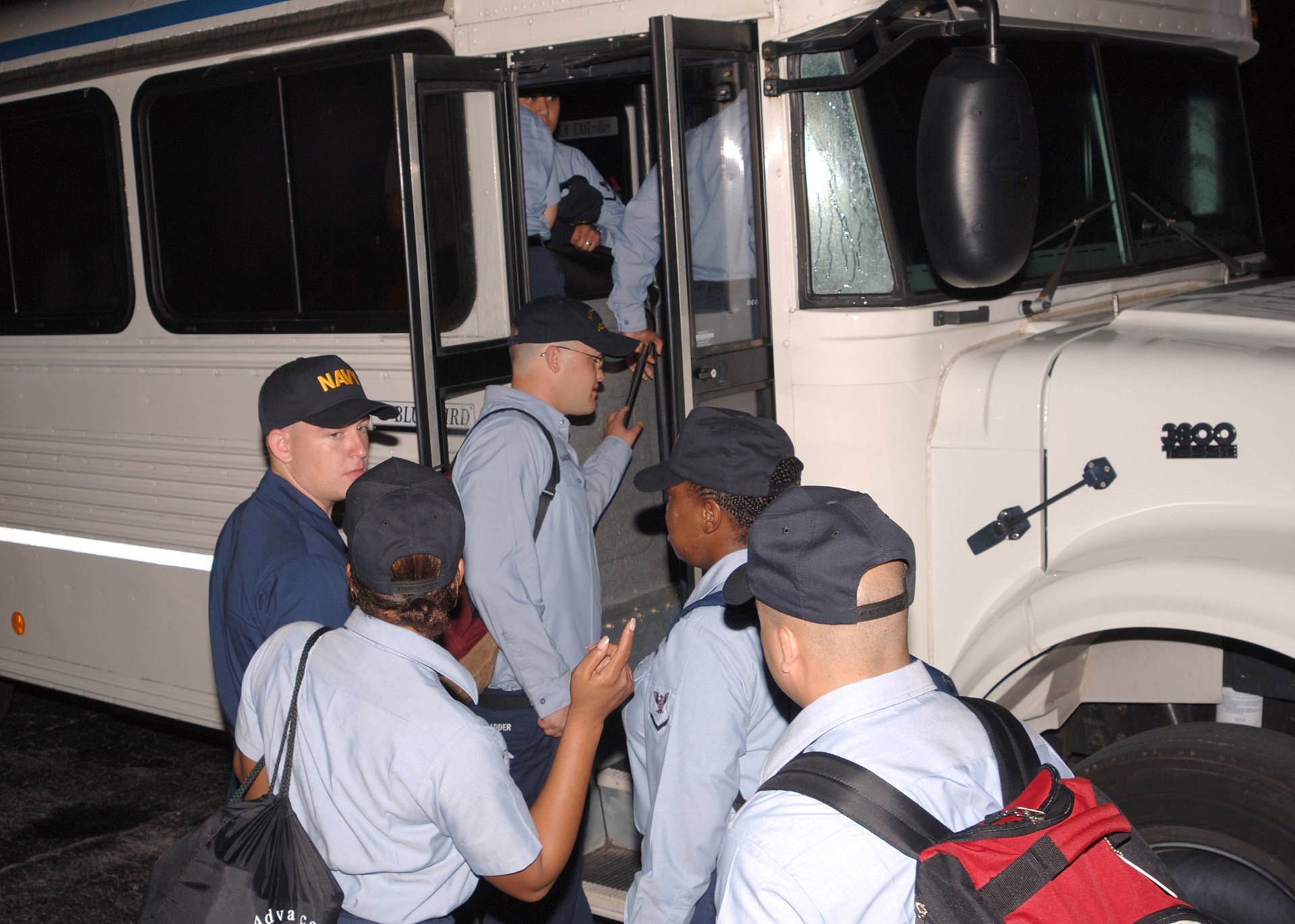 US Navy 050901 N 6407M 004 U.S. Navy medical personnel board buses as they depart Naval Air Station Jacksonville, Fla., for deployment