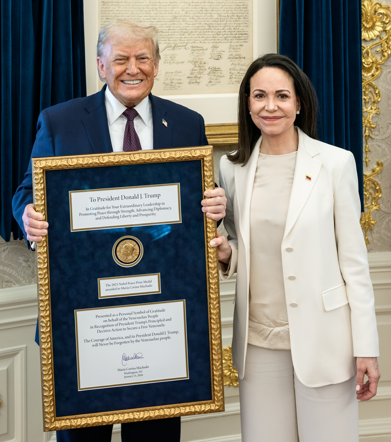 15 January 2026, President Donald Trump is gifted the Nobel Peace Prize medal awarded to Maria Corina Machado at the White House Oval Office (cropped)