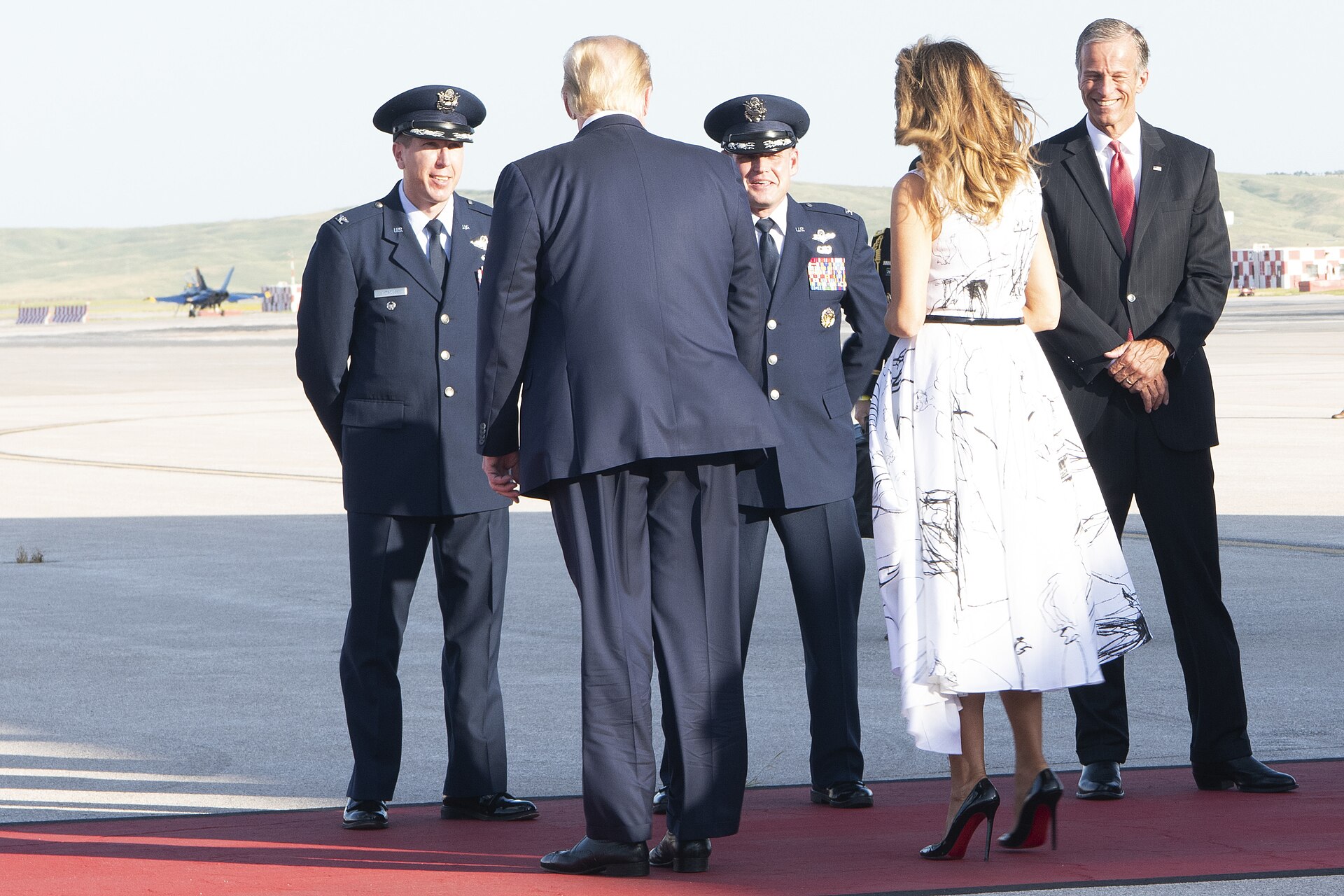 President Donald Trump and First Lady Melania Trump greet Senator John Thune, Colonel Daniel Hoadley, and Colonel David Doss