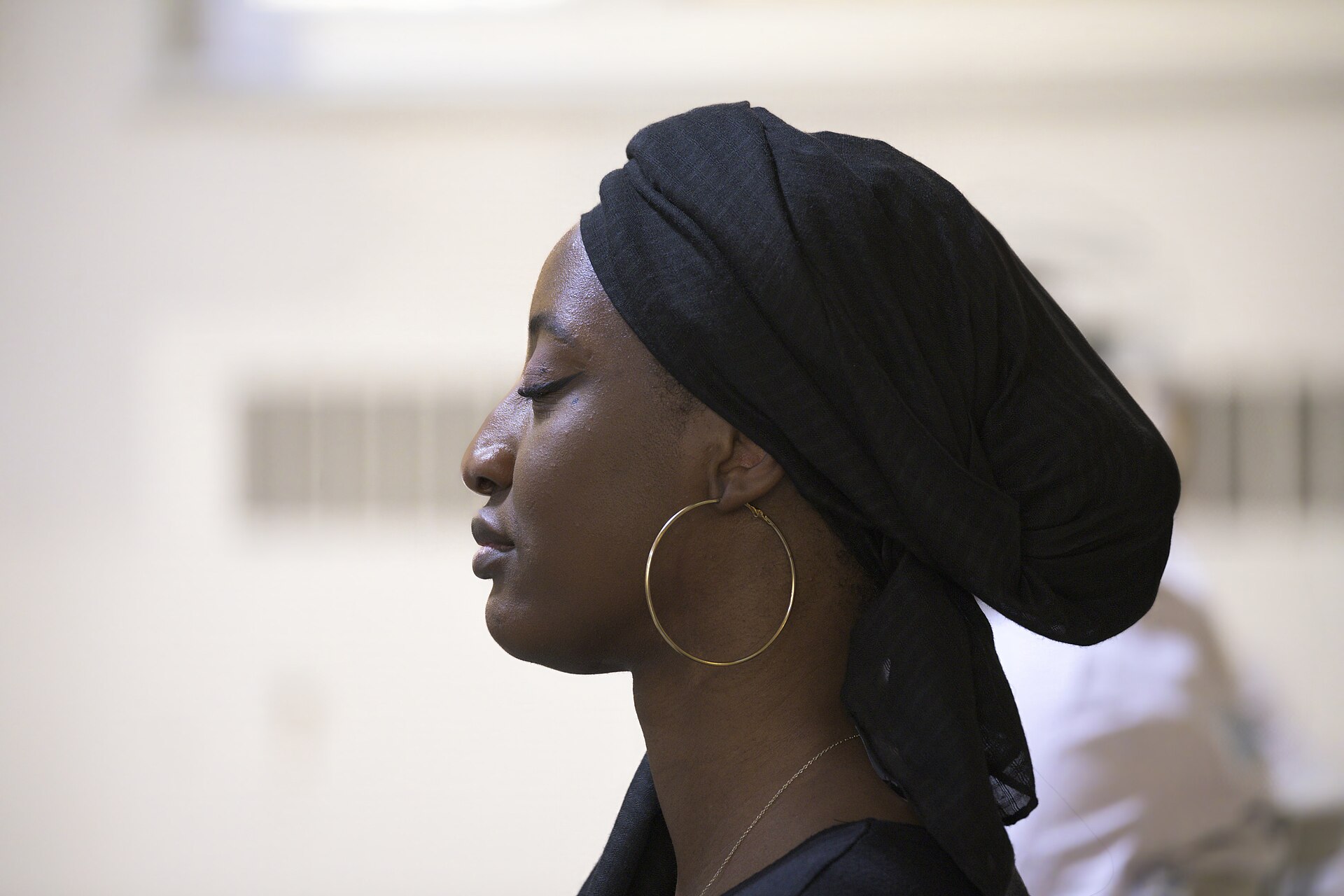 Praying woman in Evangel Pentecostal Church Quebec City, Canada