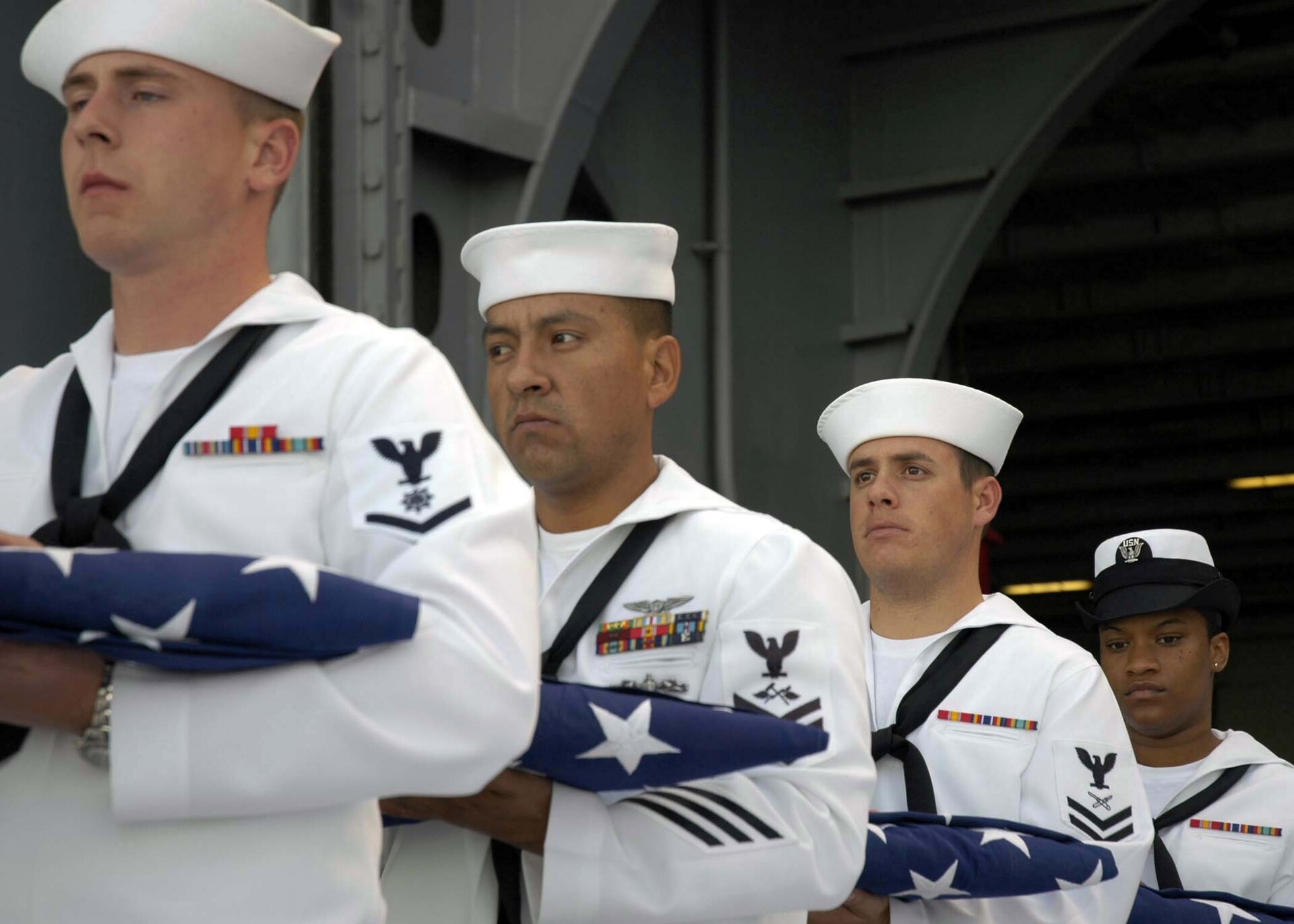 US Navy 050912 N 5384B 012 Several flag bearers take part in a burial at sea aboard the Nimitz class aircraft carrier USS Abraham Lincoln (CVN 72)