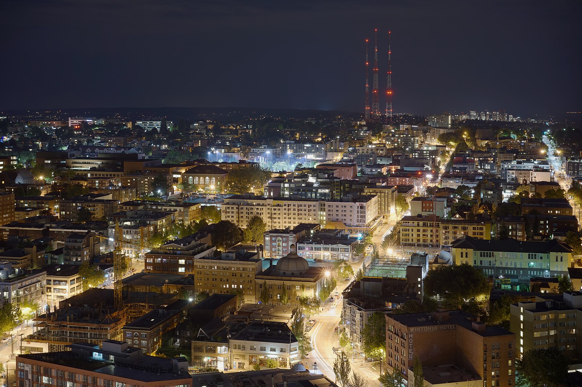 High rise view of Capitol Hill at night, looking east from Pine and 9th